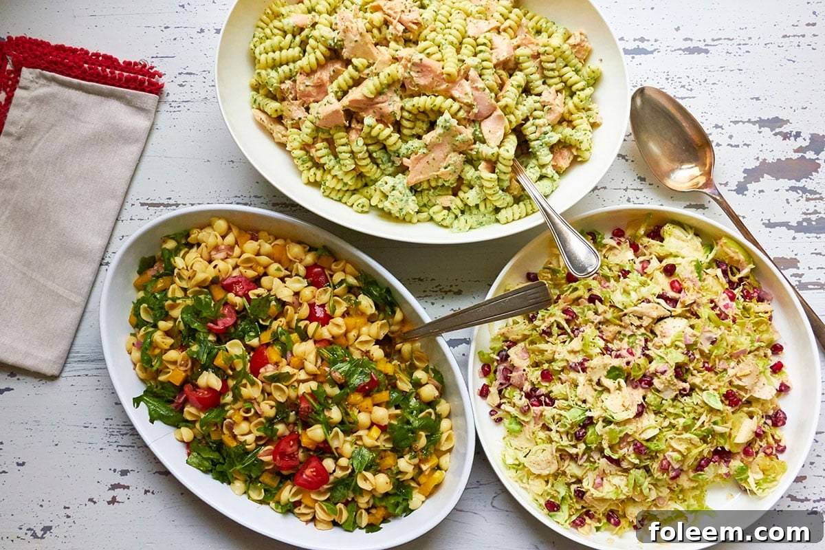Bowl of Mayo-Free Vegan Pasta Salad on a table with other pasta salads.