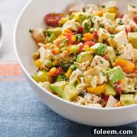 Chicken and Avocado Salad in white bowl.