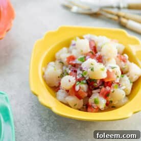 Scallop Ceviche in yellow bowl.