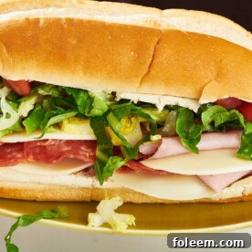 Grinder Sandwich on gold-colored plate.