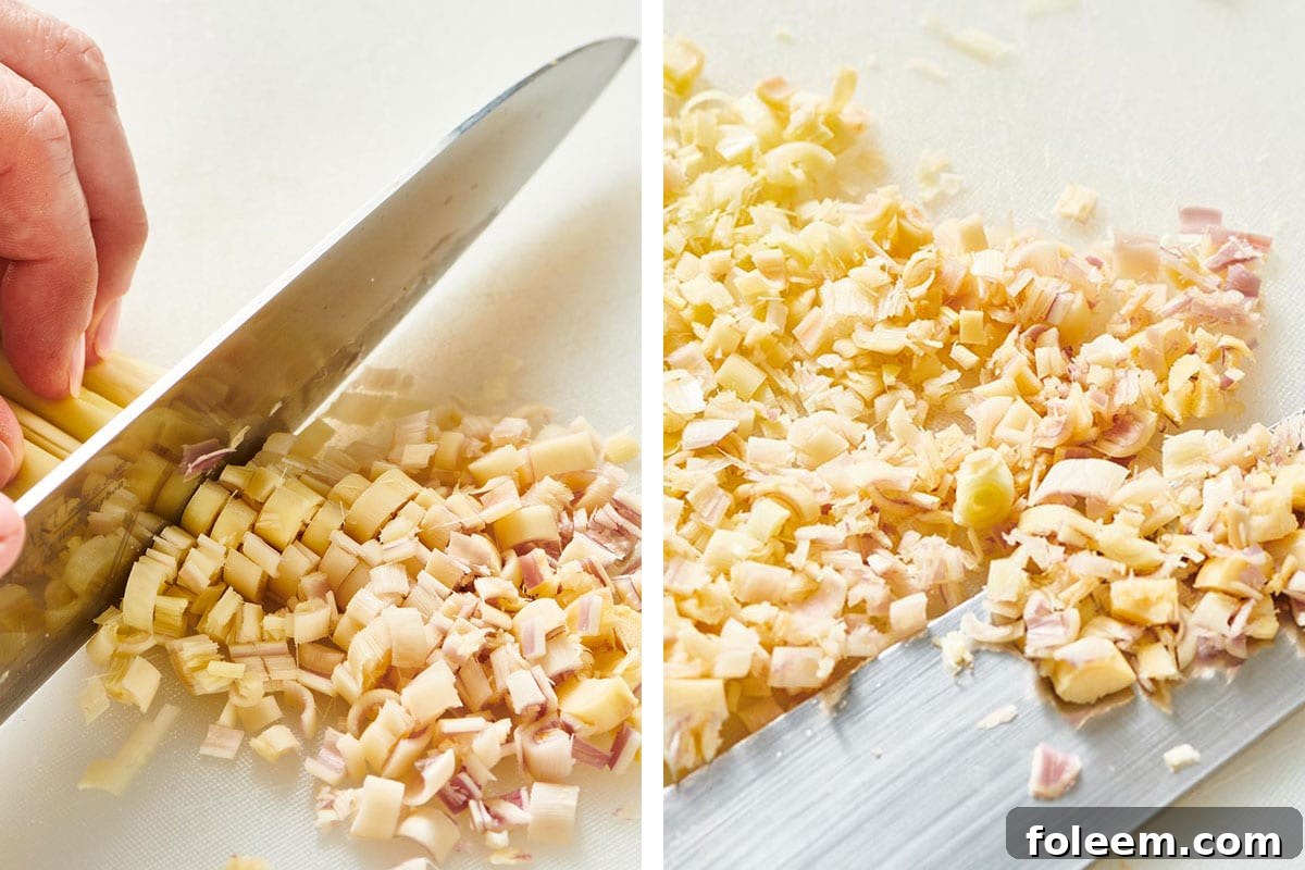Chopping fresh lemongrass with chef knife.