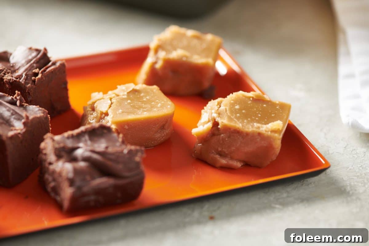 Slices of Brown Sugar Fudge and other fudge on an orange plate.