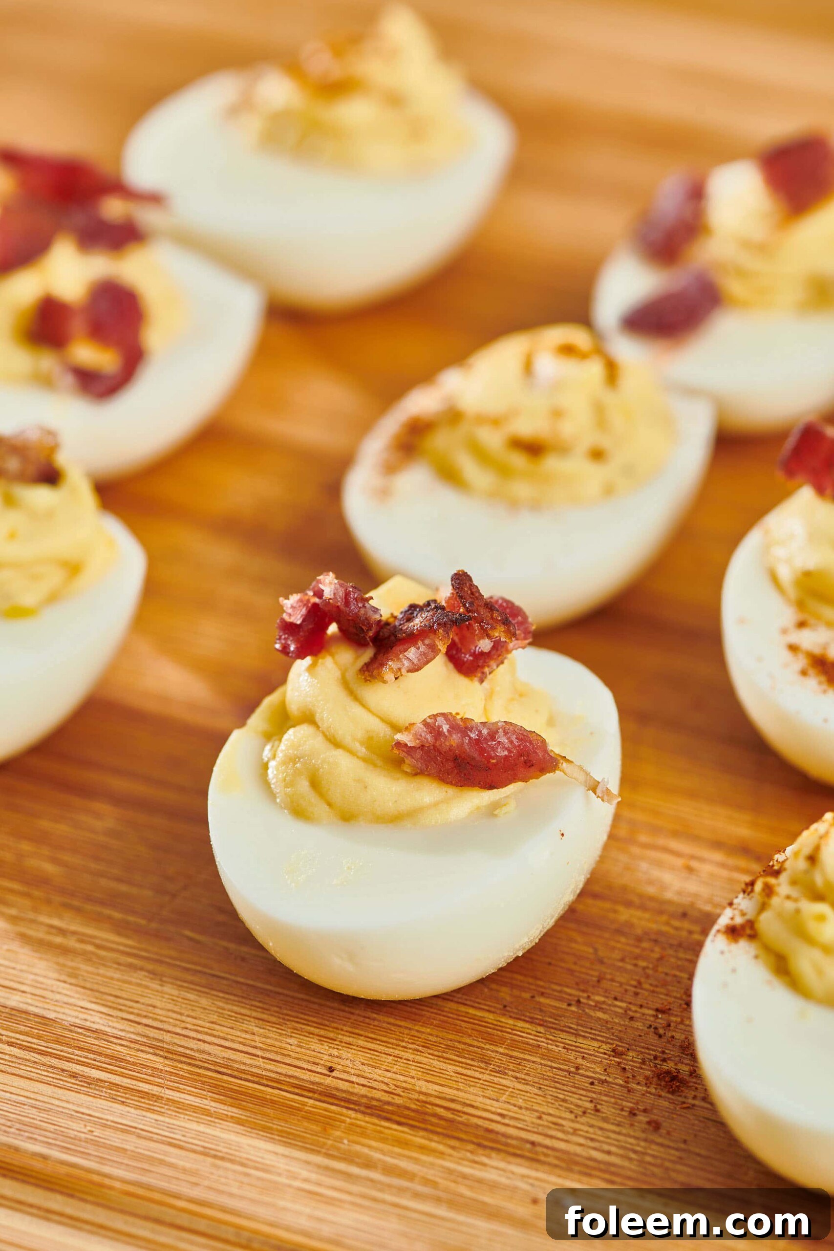 Deviled eggs on cutting board.