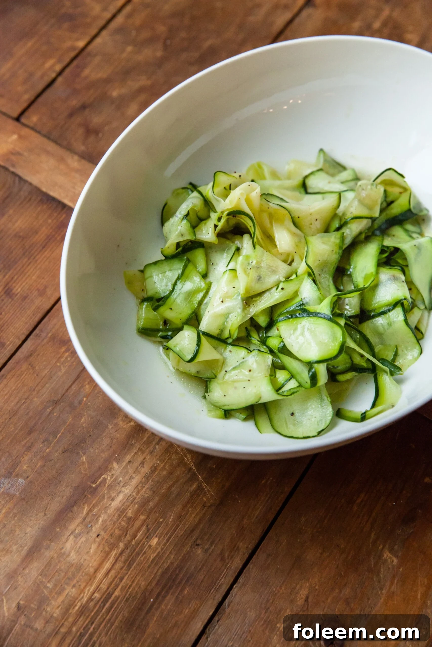 Thin slices of zucchini forming a Zucchini Ribbon Salad.