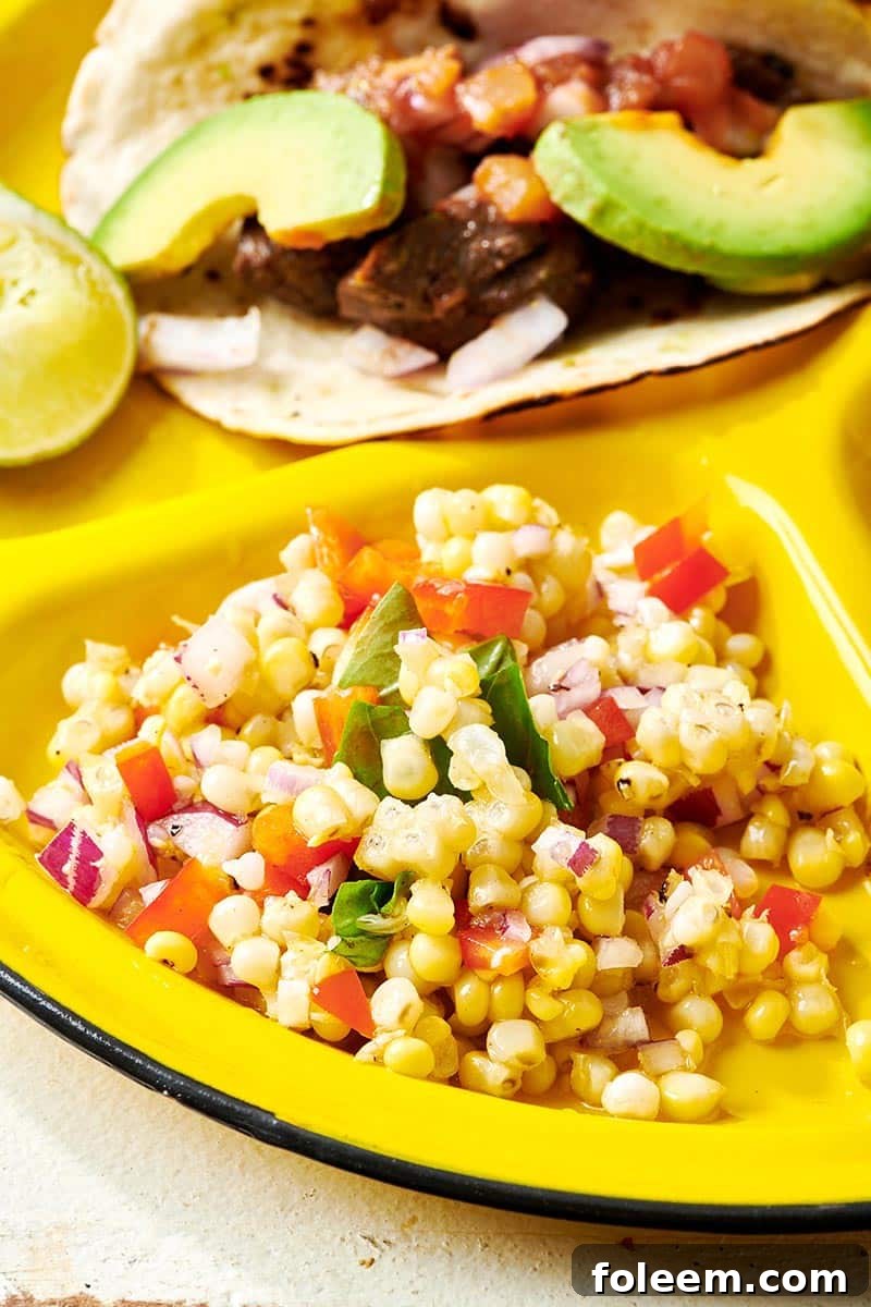 Grilled Corn Salad on yellow plate.